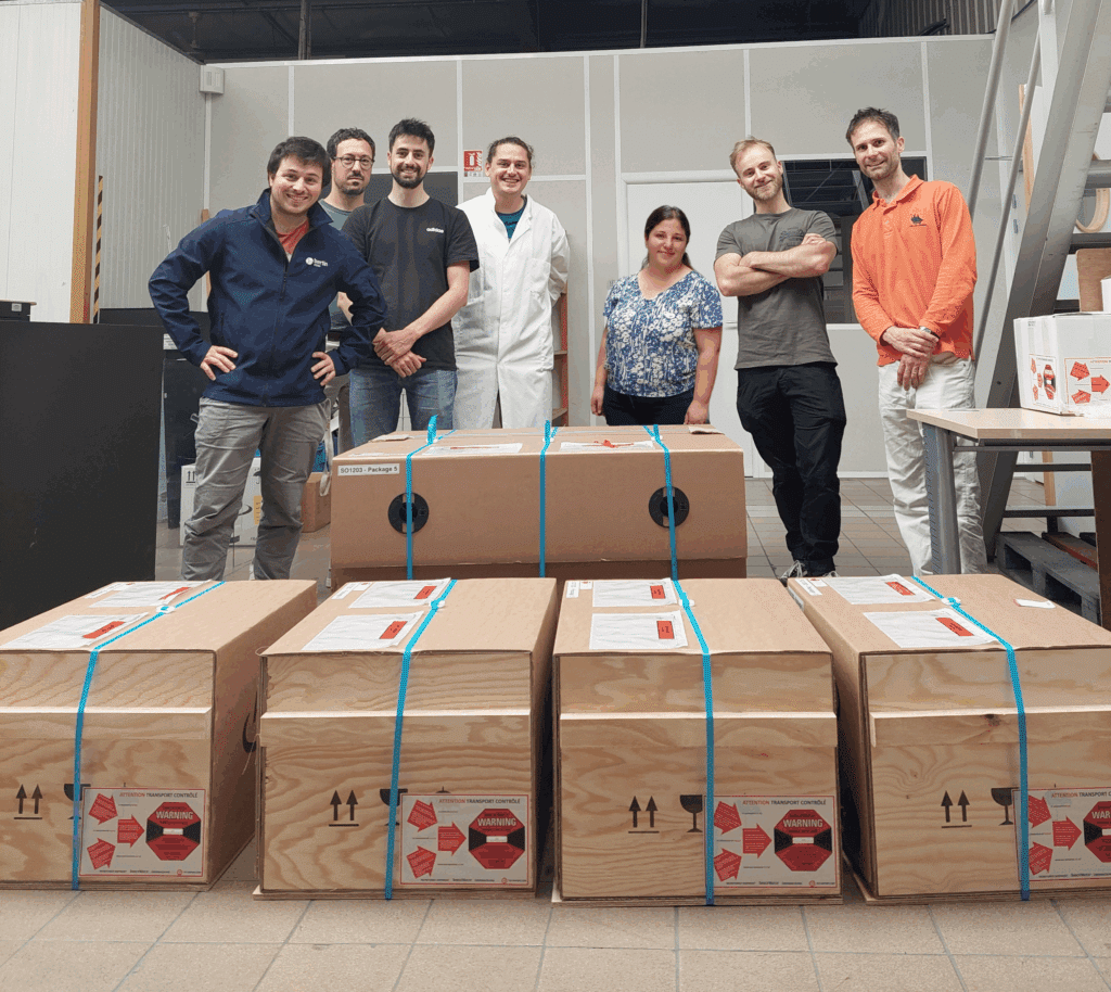 Bertin Alpao team in front of the shipping boxes meant to be delivered to the Very Large Telescope (VLT) on the MAVIS adaptive optics instrument. 
