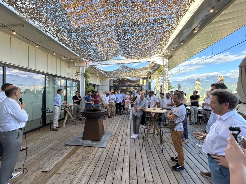 Group photo of COMEX members and Bertin Alpao employees celebrating the company’s first anniversary at Restaurant Ciel in Grenoble